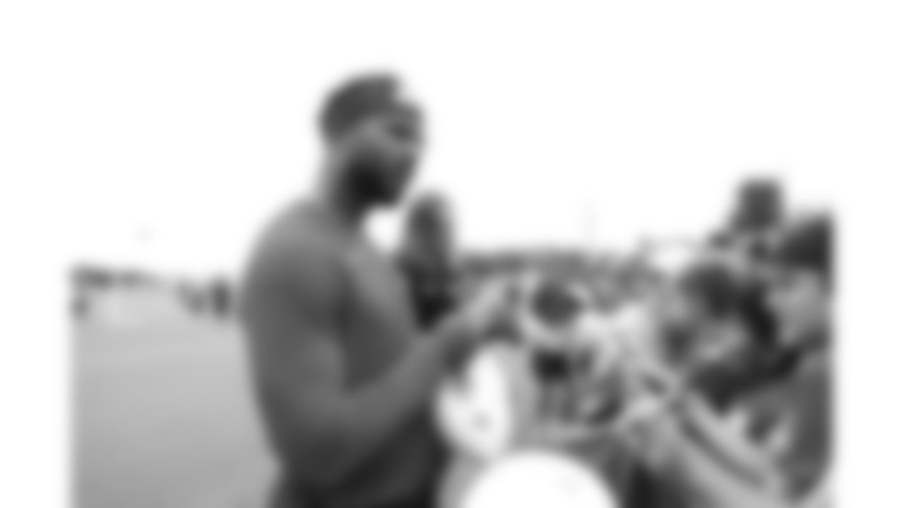 Kansas City Chiefs quarterback Chris Oladokun (19) signs fans merchandise after day 11 of Training Camp practice on Sunday, August 3, 2025.