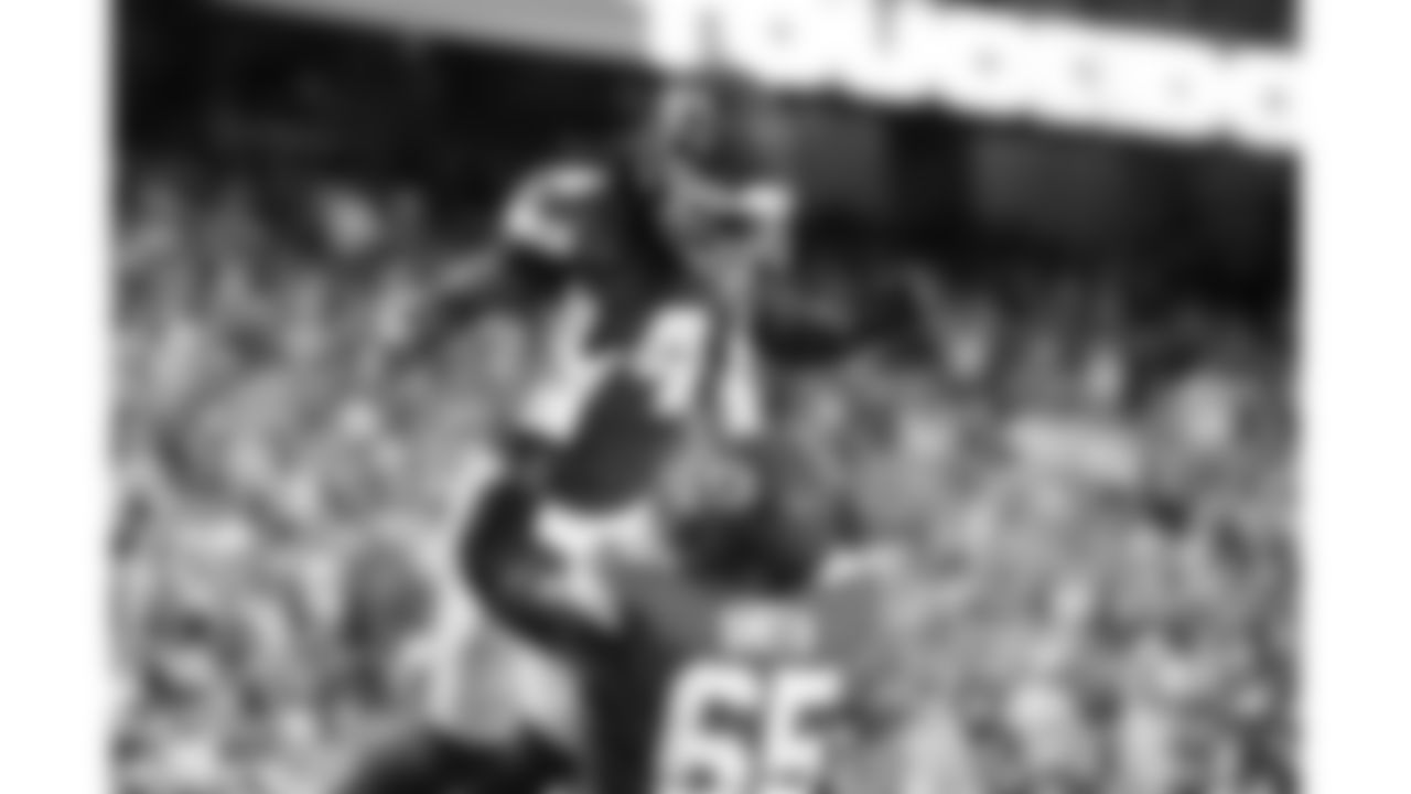 Kansas City Chiefs offensive lineman Trey Smith (65) lifts wide receiver Rashee Rice (4) in the end zone during a preseason week 3 NFL football game against the Chicago Bears, Friday, August 22, 2025 in Kansas City, MO.