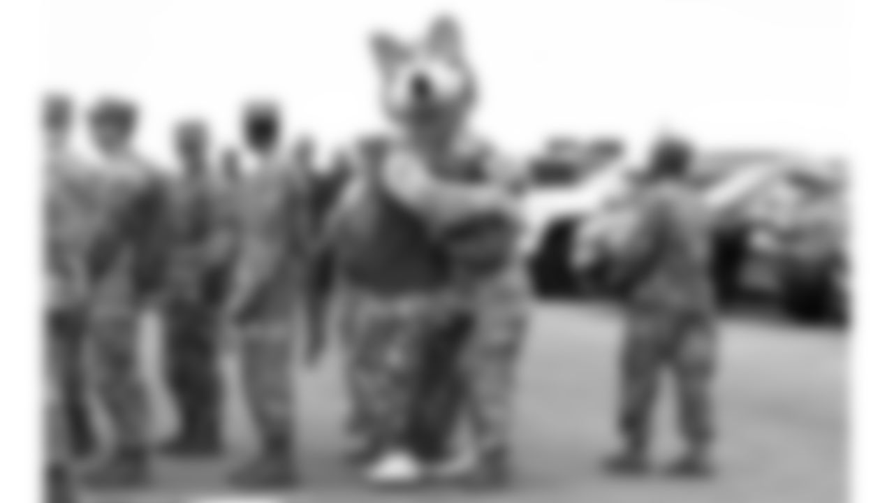 KC Wolf and a service member during day 2 of the Season Ticket Member First Look Event on Wednesday June 18, 2025 in Kansas City, MO.