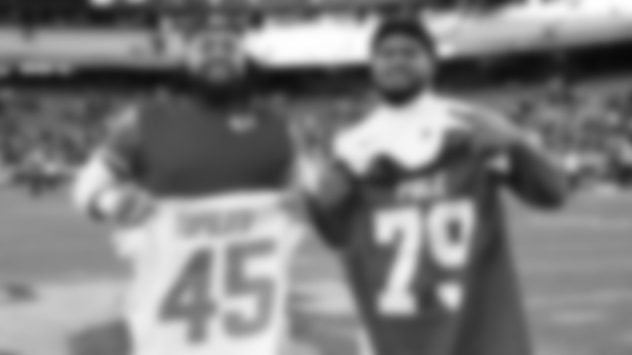 Kansas City Chiefs defensive tackle Zach Picken (79) swap jerseys with San Diego Chargers Tuli Tuipulotu (45) after an NFL week 15 matchup against the Los Angeles Chargers, Sunday December 14, 2025.