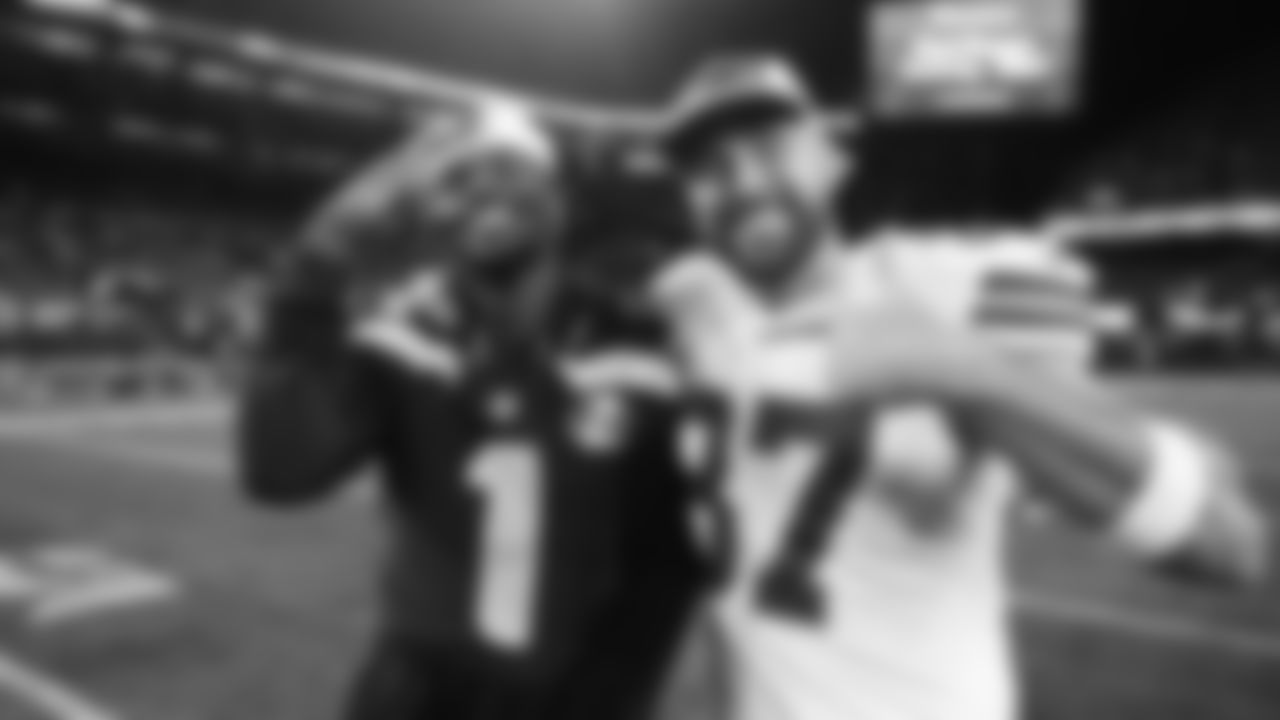 Kansas City Chiefs tight end Travis Kelce (87) poses for a photo with Seattle Seahawks wide receiver Marquez Valdes-Scantling (1) following a preseason week 2 NFL football game, Friday, August 15, 2025 in Seattle, WA.