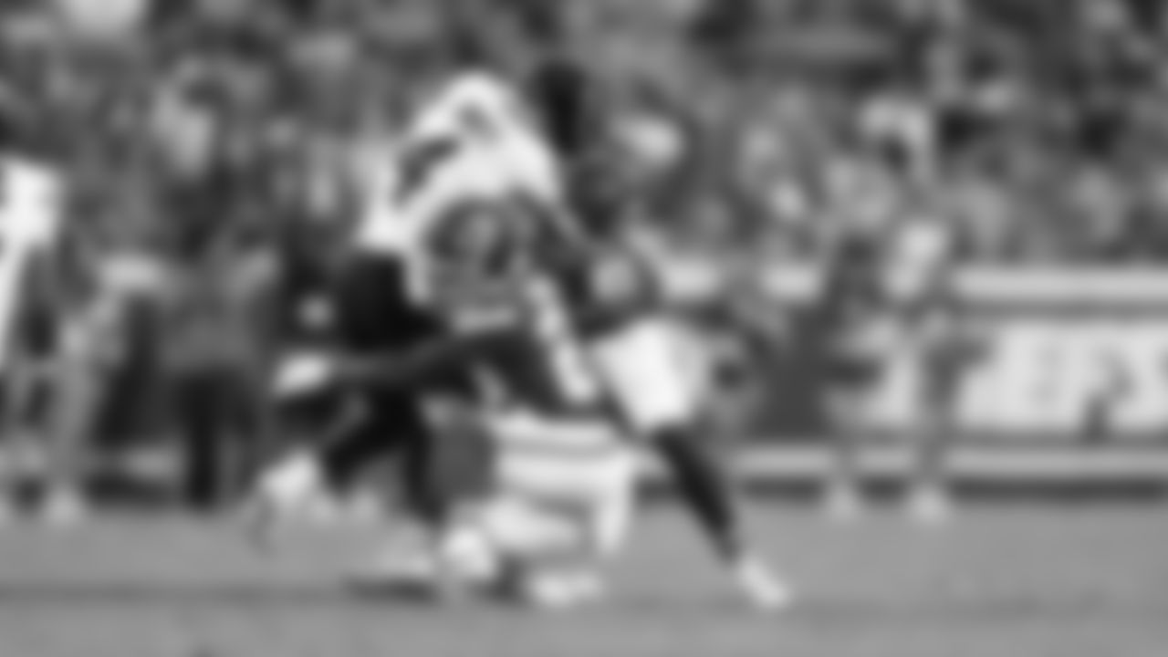 Kansas City Chiefs defensive back Chamarri Conner (27) and Kansas City Chiefs cornerback Trent McDuffie (22) makes a tackle during a preseason week 3 NFL football game against the Chicago Bears, Friday, August 22, 2025 in Kansas City, MO.