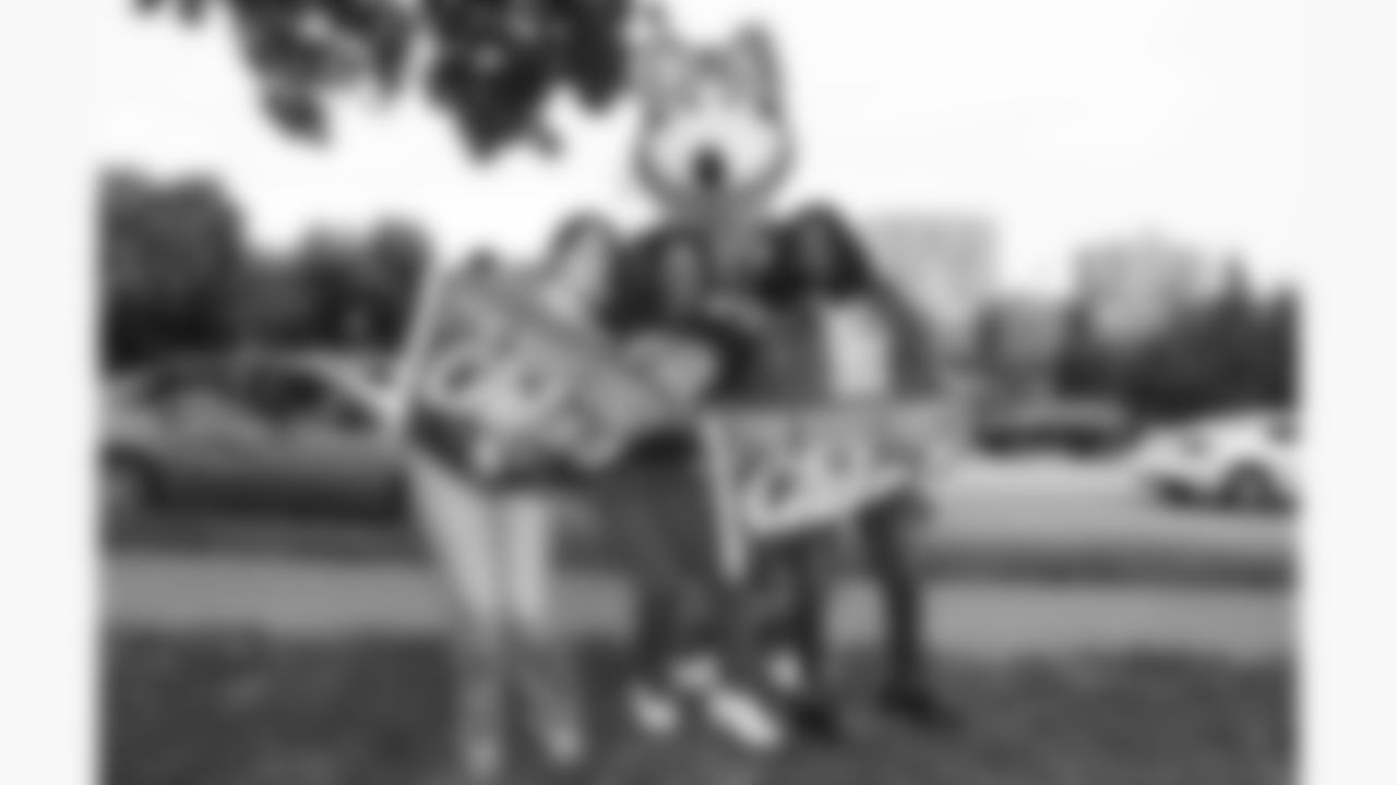 KC Wolf poses with Kansas City Chiefs fans during Red Friday on September 5, 2025 at the Plaza in Kansas City, MO.