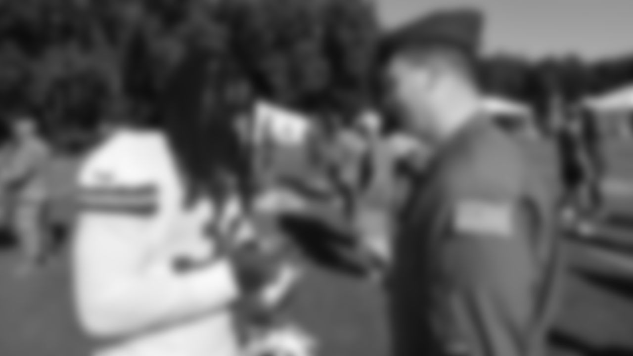 U.S. service members meet with Kansas City Chiefs linebacker Nick Bolton (32) while attending Military Appreciation Day during day 17 of Training Camp practice on Wednesday, August 13, 2025.