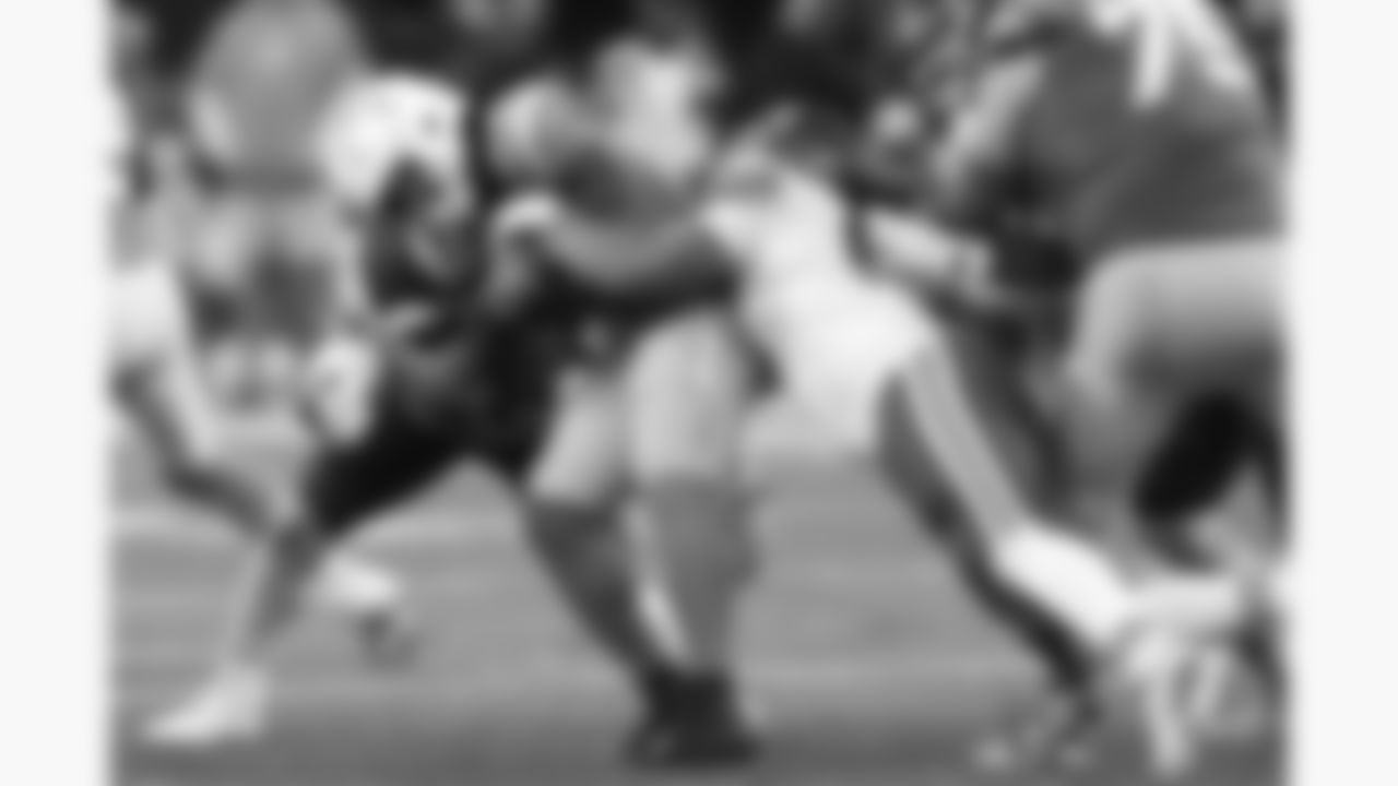 Kansas City Chiefs defensive tackle Derrick Nnadi (92) and defensive end Ashton Gillotte (97) make a tackle on Los Angeles Chargers running back Omarion Hampton (8) during a week 1 NFL football game against the Los Angeles Chargers at Arena Corinthians in São Paulo, Brazil on September 5, 2025.