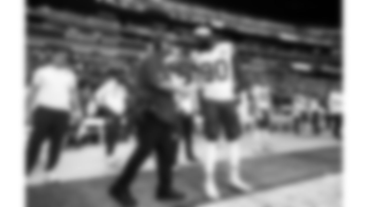 Kansas City Chiefs Head Coach Andy Reid shakes hands with defensive end Charles Omenihu (90) on the sideline prior to a week 18 NFL football game against the Las Vegas Raiders, Sunday, January 4, 2026 in Las Vegas, NV.