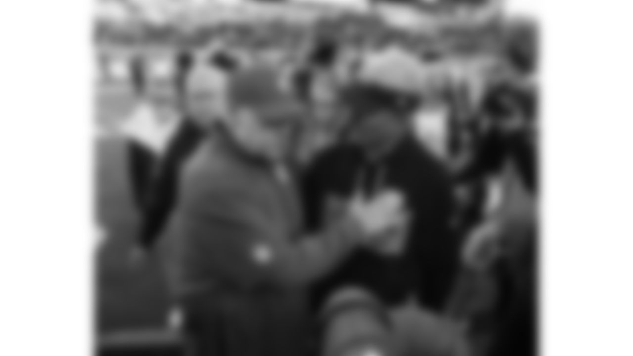 Titans Head Coach Mike McCoy and Kansas City Chiefs Head Coach Andy Reid meet after a week 16 NFL Football game against the Tennessee Titans on Sunday, December 21, 2025 in Nashville, Tennessee.