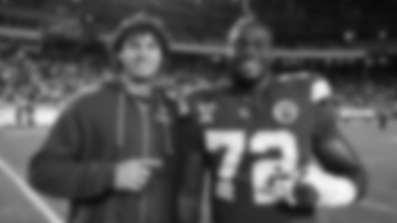 Kansas City Chiefs tackle Chukwuebuka Godrick (72) poses with a Denver Bronco after an NFL week 17 matchup against the Denver Broncos, Thursday, December 25, 2025.