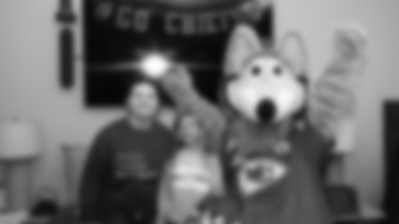 KC Wolf interacts with families before the reveal of cornerback Trent McDuffies (22) My Cause My Cleats at the Solace House in Shawnee Mission, Kansas on Tuesday, November 11, 2025.