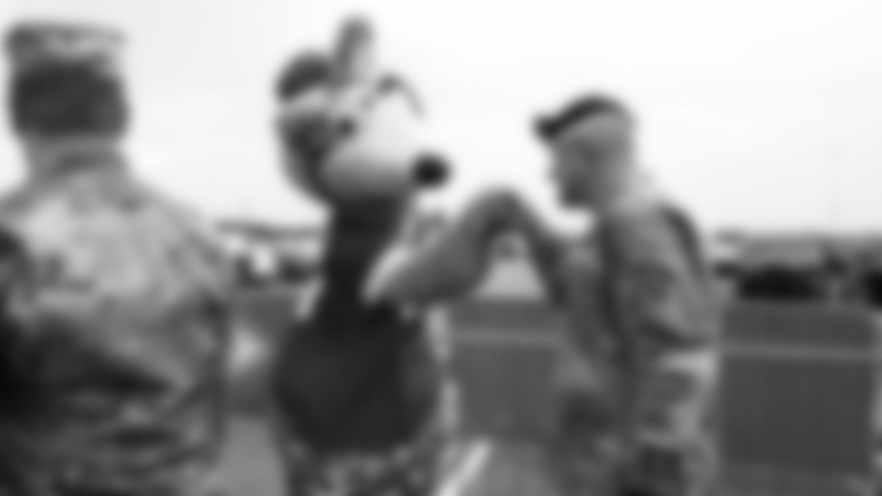KC Wolf and a service member during day 2 of the Season Ticket Member First Look Event on Wednesday June 18, 2025 in Kansas City, MO.