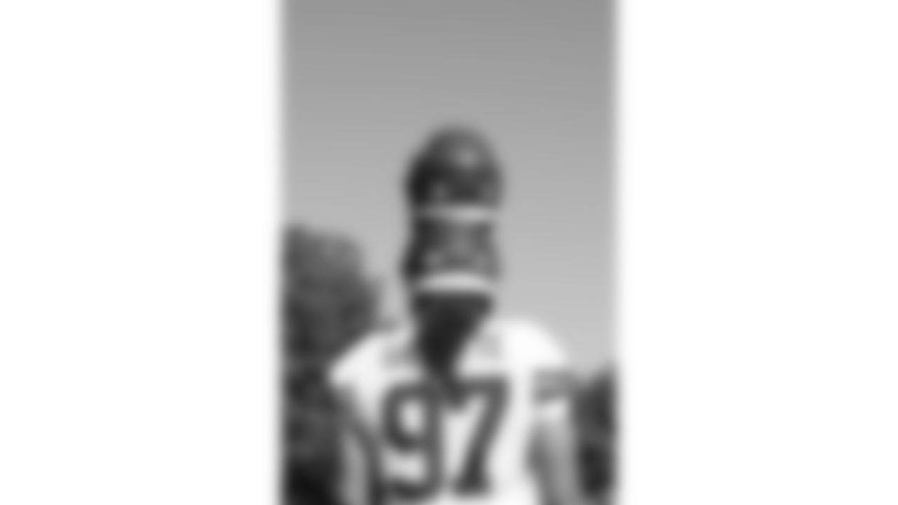 Kansas City Chiefs defensive end Ashton Gillotte (97) balances two helmets on his head after day 17 of Training Camp practice on Wednesday, August 13, 2025.