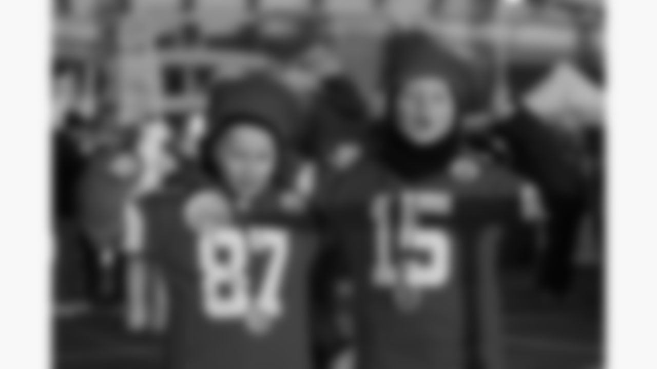 Kansas City Chiefs fans pose for a photo prior to a week 14 NFL football game against the Houston Texans, Sunday, December 7, 2025 in Kansas City, MO.