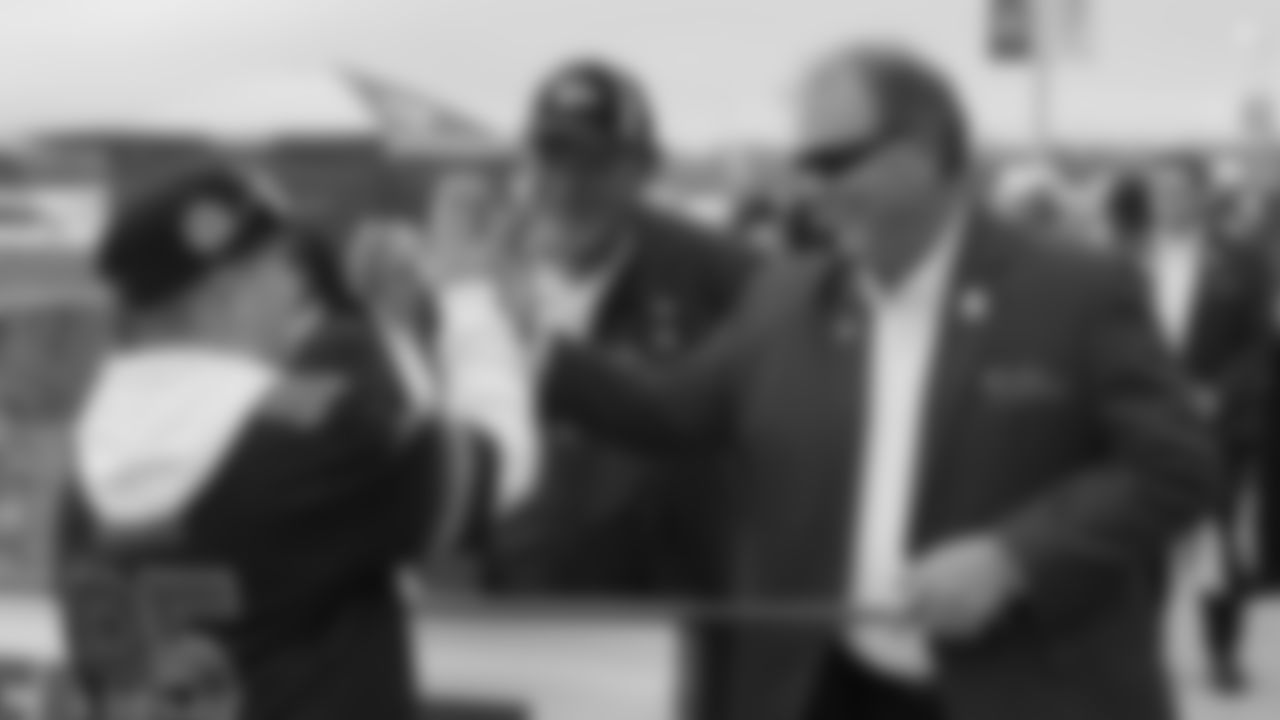 The Red Coaters and a fan before a week 12 NFL football game against the Indianapolis Colts, Sunday, November 23, 2025 in Kansas City, MO.