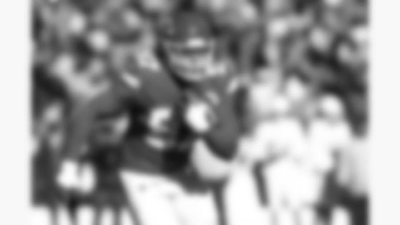 Kansas City Chiefs defensive end Ashton Gillotte (97) intercepts the ball during a week 15 NFL football game against the Los Angeles Chargers, Sunday, December 14, 2025 in Kansas City, MO.