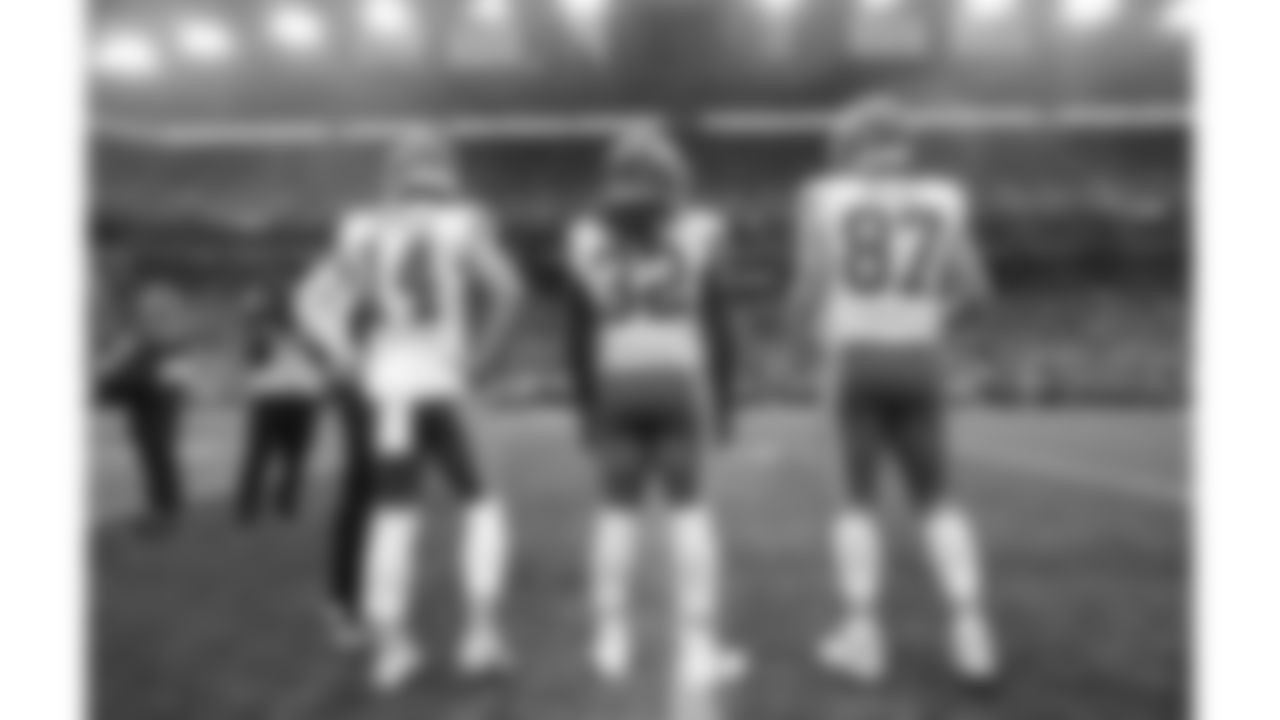Kansas City Chiefs game captains tight end Travis Kelce (87), linebacker Nick Bolton (32), and punter Matt Araiza (14) line up prior to a preseason week 2 NFL football game against the Seattle Seahawks, Friday, August 15, 2025 in Seattle, WA.
