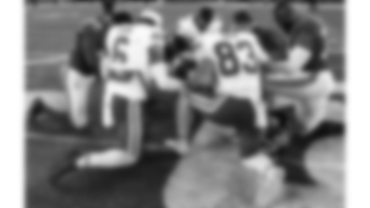 Kansas City Chiefs safety Bryan Cook (6), middle linebacker Drue Tranquill (23) and tight end Noah Gray (83) pray with New York Giants players after a week 3 NFL Football game against the New York Giants on Sunday, September 21, 2025 at MetLife Stadium in East Rutherford, New Jersey.