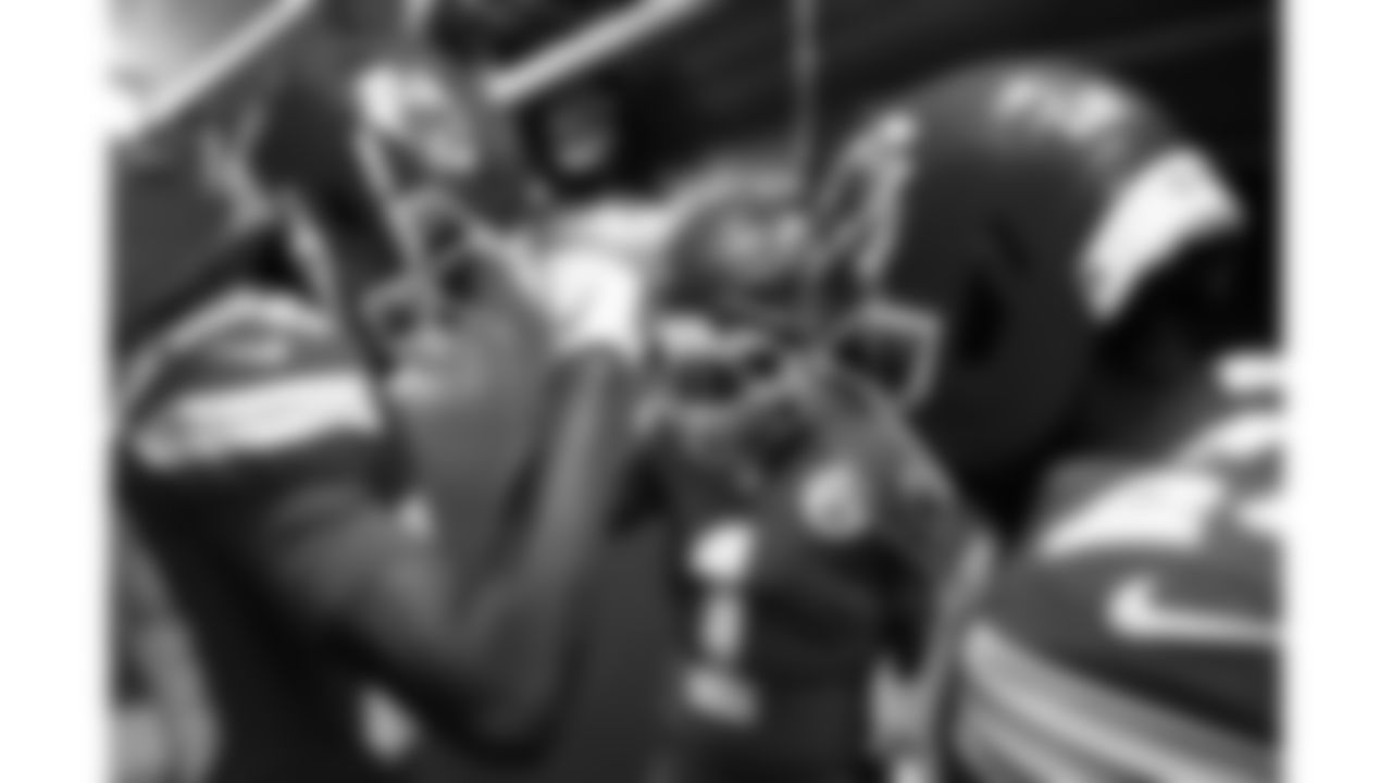 Kansas City Chiefs wide receiver Tyquan Thornton (80), wide receiver Xavier Worthy (1) and running back Brashard Smith (24) huddle in the 50-yard tunnel prior to a week 14 NFL football game against the Houston Texans, Sunday, December 7, 2025 in Kansas City, MO.