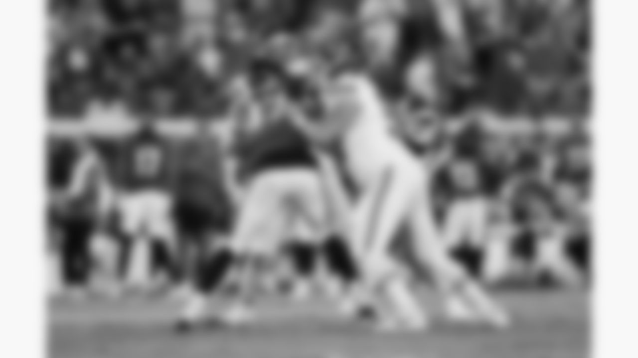 Kansas City Chiefs tackle Jawaan Taylor (74) and center Creed Humphrey (52) block against Jacksonville Jaguars linebacker Dennis Gardeck (47) during the week 5 NFL football game, Monday, October 6, 2025 in Jacksonville, FL.