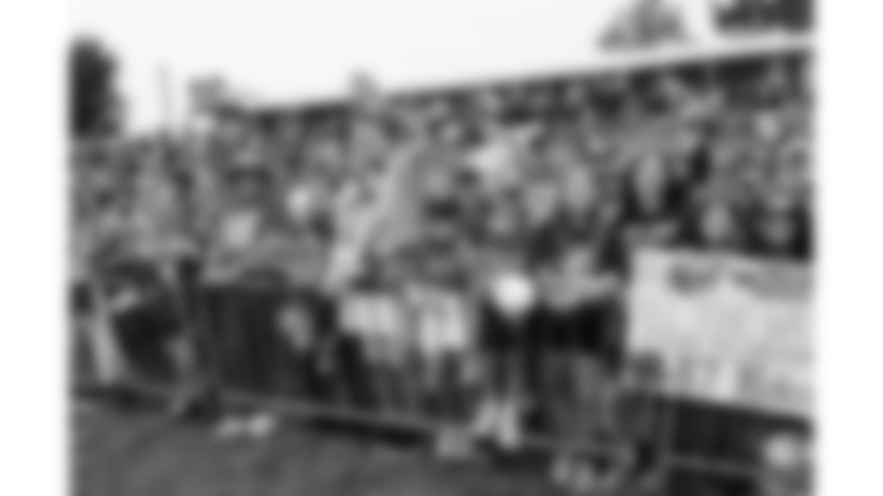 Kansas City Chiefs fans wave to players during day 11 of training camp practice on Sunday, August 3, 2025.