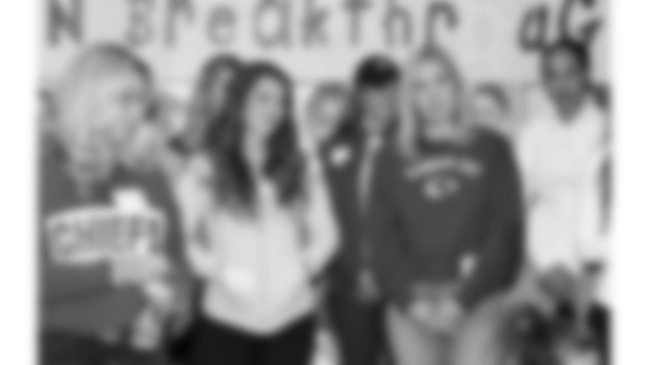 Women from the Chiefs Women's Organization visit with children at Operation Breakthrough on Thursday, December 5, 2024 in Kansas City, MO.