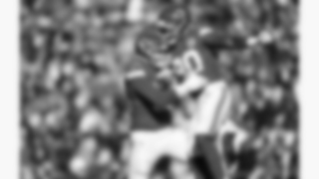 Kansas City Chiefs defensive end George Karlaftis (56) and defensive end Charles Omenihu (90) celebrate during a week 15 NFL football game against the Los Angeles Chargers, Sunday, December 14, 2025 in Kansas City, MO.