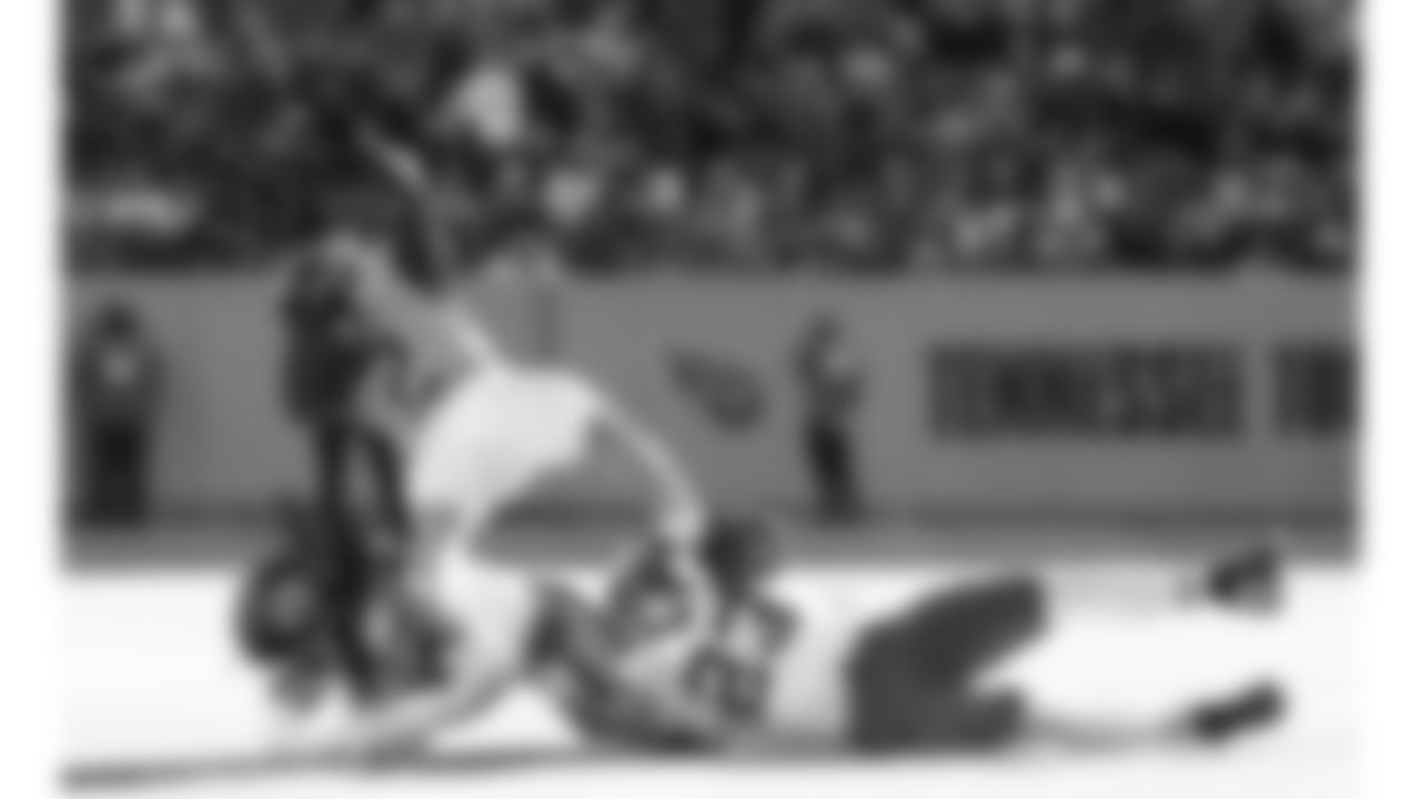 Kansas City Chiefs linebacker Nick Bolton (32) and middle linebacker Drue Tranquill (23) tackle Tennessee Titans running back Tyjae Spears (2) during a week 16 NFL football game, Sunday, December 21, 2025 in Nashville, TN.