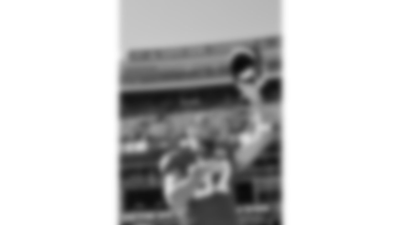 Kansas City Chiefs tight end Travis Kelce (87) raises his helmet over his head during the National Anthem prior to a week 7 NFL football game against the Las Vegas Raiders, Sunday, October 19, 2025 in Kansas City, MO.