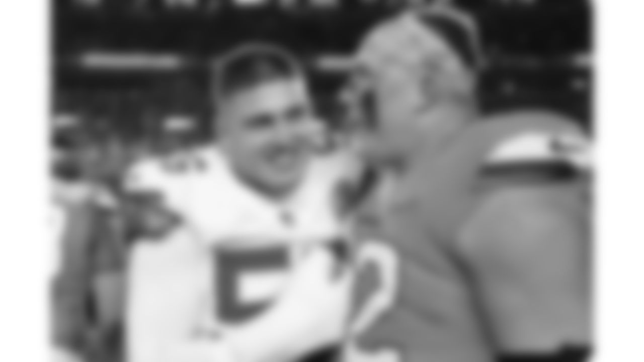 Kansas City Chiefs defensive end George Karlaftis (56) and Broncos tackle Garett Bolles (72) after a week 11 NFL Football game against the Denver Broncos on Sunday, November 16, 2025 in Denver, Colorado.