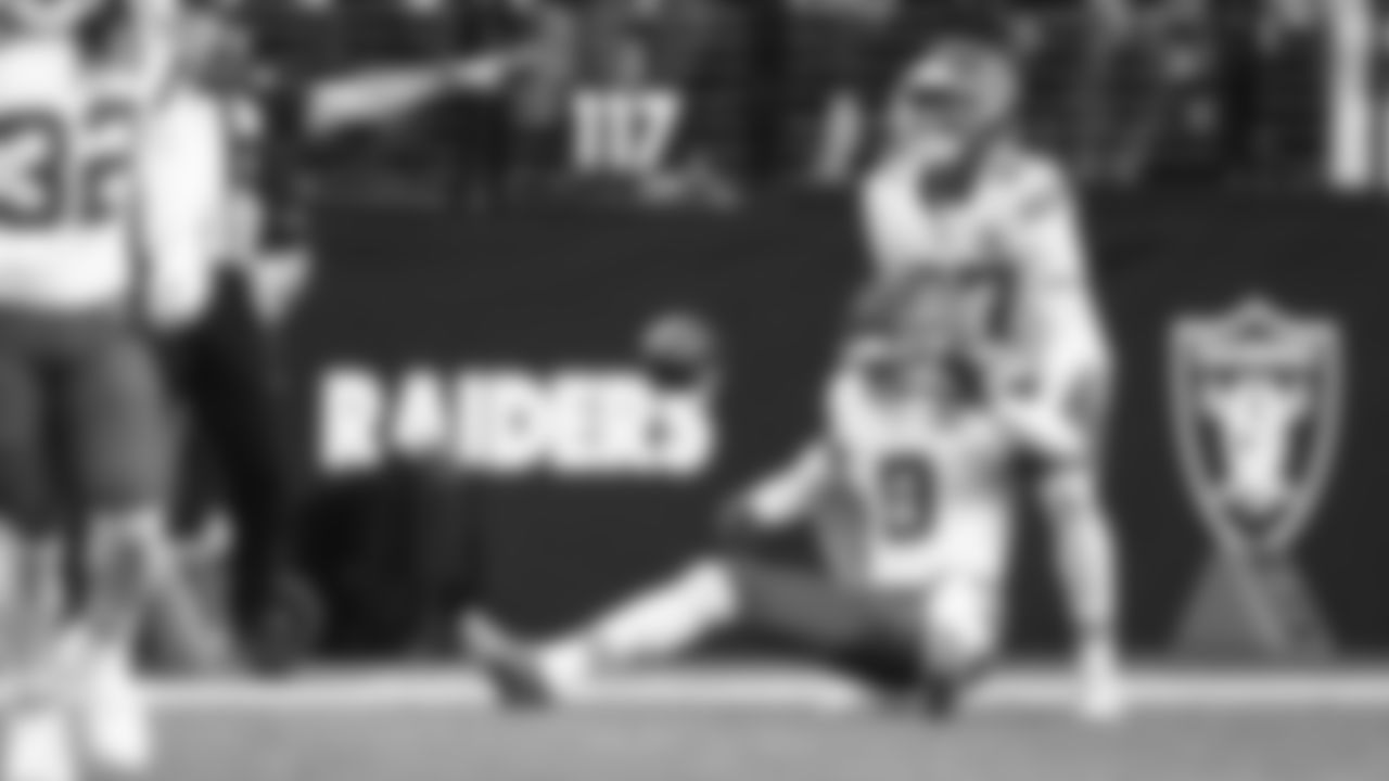 Kansas City Chiefs defensive back Chamarri Conner (27) helps cornerback Kristian Fulton (8) up during a week 18 NFL football game against the Las Vegas Raiders, Sunday, January 4, 2026 in Las Vegas, NV.