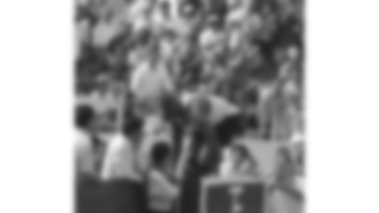 Neil Smith jumps into the stands at a bull fight during the 1996 preseason trip to Monterrey, Mexico.