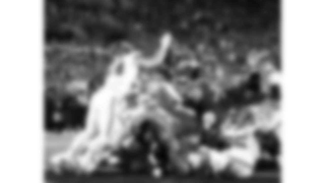 Kansas City Chiefs linebacker Nick Bolton (32) forces a fumble by Jacksonville Jaguars quarterback Trevor Lawrence (16) during the week 5 NFL football game, Monday, October 6, 2025 in Jacksonville, FL.