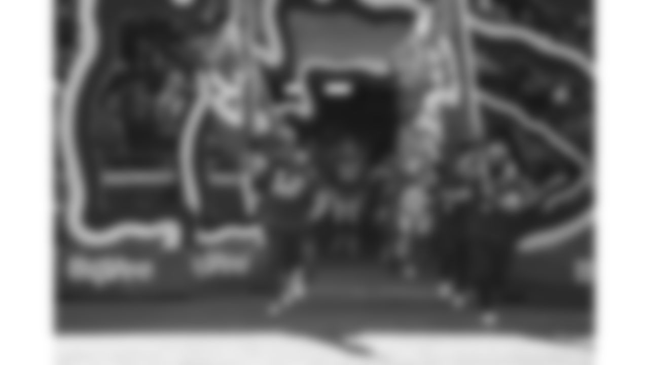 Chiefs Flag Runners enter the field prior to a week 15 NFL Football game against the Los Angeles Chargers on Sunday, December 14, 2025 in Kansas City, MO.