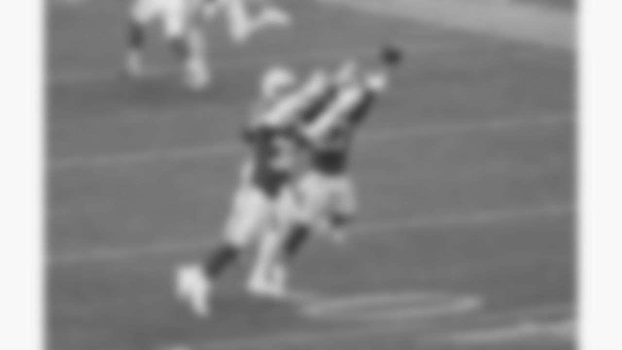 Kansas City Chiefs linebacker Nick Bolton (32) and defensive back Chamarri Conner (27) break up a pass during a week 12 NFL football game against the Indianapolis Colts, Sunday, November 23, 2025 in Kansas City, MO.