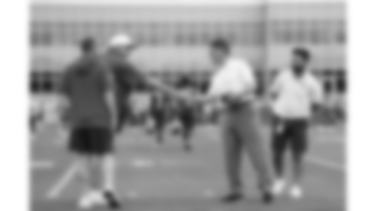 Kansas City Chiefs Chairman, CEO, and Owner Clark Hunt and Head Coach Andy Reid shake hands during day 1 of the Season Ticket Member First Look Event on Tuesday June 17, 2025 in Kansas City, MO.