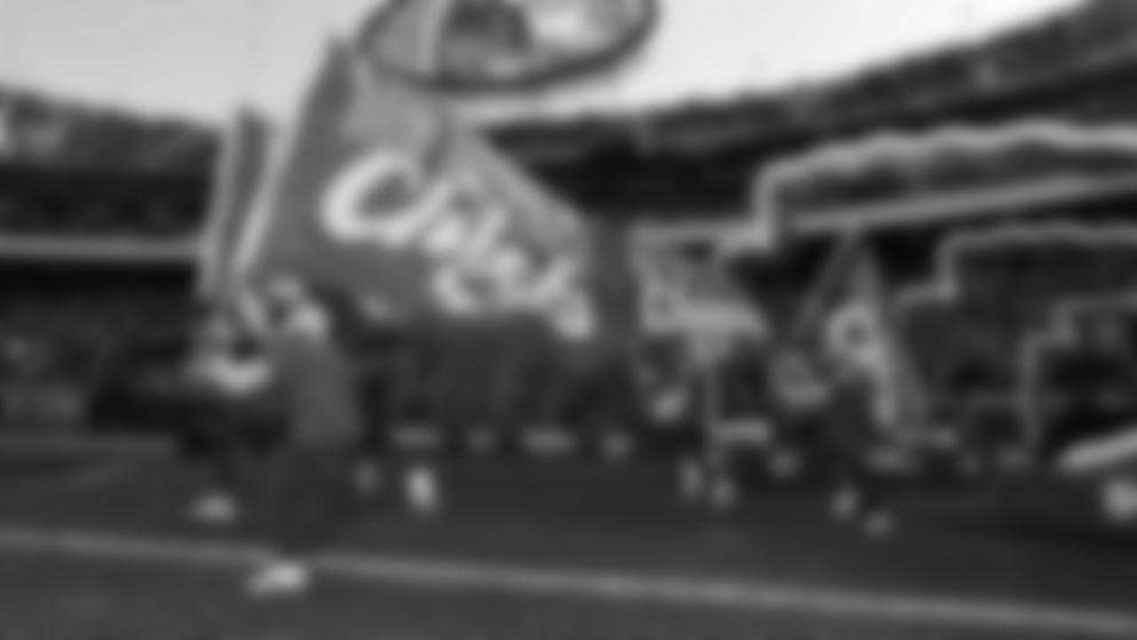 Flag Runners run onto the field prior to an NFL week 15 matchup against the Los Angeles Chargers, Sunday December 14, 2025.