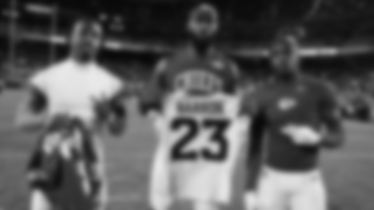 Defensive end Charles Omenihu (90) and Kansas City Chiefs wide receiver Xavier Worthy (1) pose with Denver Broncos corner back Jahdae Barron (23) after an NFL week 17 matchup against the Denver Broncos, Thursday, December 25, 2025.