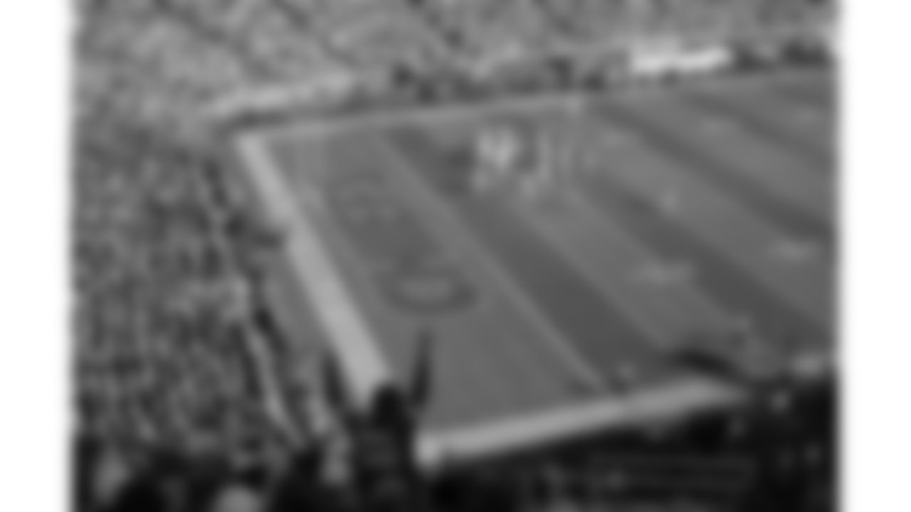 A Kansas City Chiefs fan cheers from the stands during a week 12 NFL football game against the Indianapolis Colts, Sunday, November 23, 2025 in Kansas City, MO.