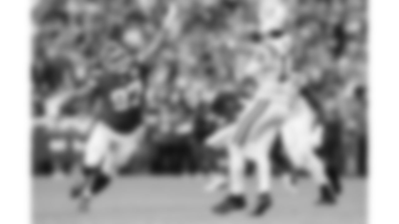 Indianapolis Colts quarterback Daniel Jones (17) throws the ball under pressure from Kansas City Chiefs defensive end Ashton Gillotte (97) during a week 12 NFL football game, Sunday, November 23, 2025 in Kansas City, MO.