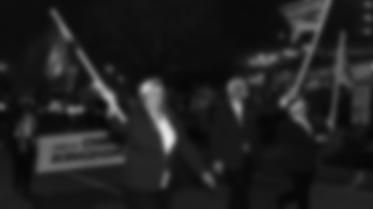 Red Coaters in the parade prior to an NFL week 17 matchup against the Denver Broncos, Thursday, December 25, 2025.