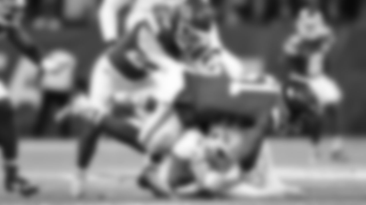 Kansas City Chiefs middle linebacker Drue Tranquill (23) and defensive end Mike Danna (51) make a tackle during the regular season Week 9 NFL Football Game on Sunday, November 5, 2023 at Deutsche Bank Park in Frankfurt, Germany.