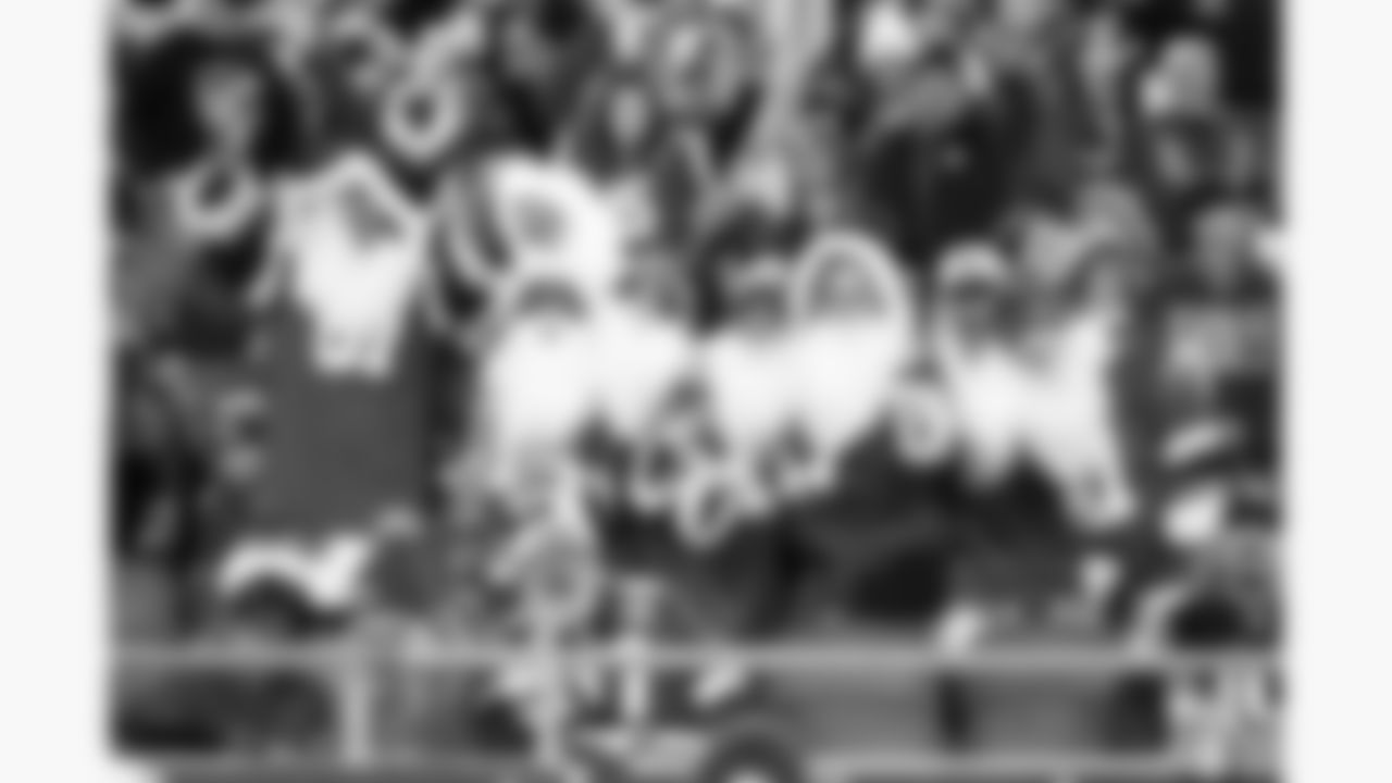 Kansas City Chiefs fans dressed as Santa hold up Bud Light cans prior to a week 17 NFL football game against the Denver Broncos, Thursday, December 25, 2025 in Kansas City, MO.