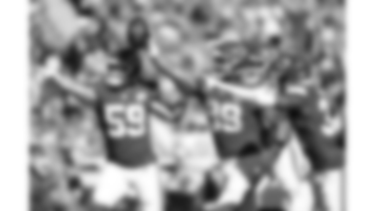 Kansas City Chiefs defensive lineman Jerry Tillery (99) celebrates with linebacker Cooper McDonald (59) and linebacker Jeffrey Bassa (31) after recovering the ball during a week 7 NFL football game against the Las Vegas Raiders, Sunday, October 19, 2025 in Kansas City, MO.