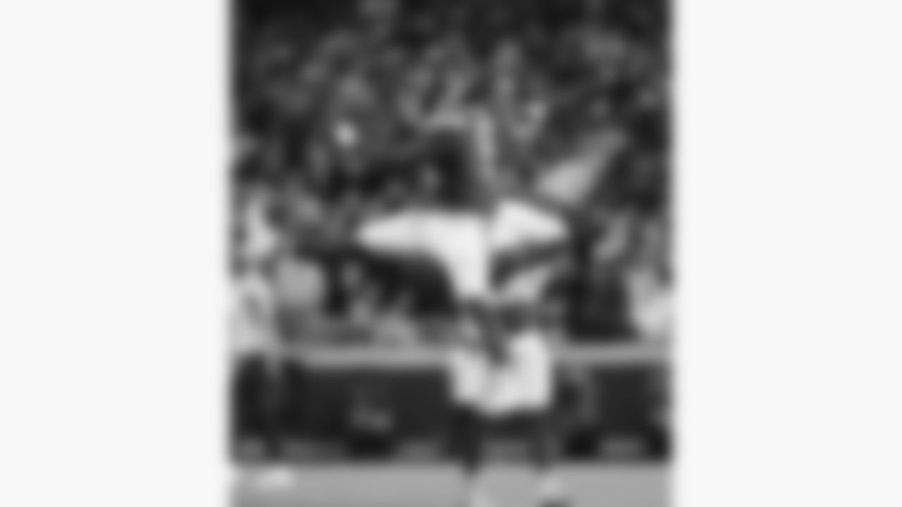 Kansas City Chiefs defensive end Mike Danna (51) and defensive back Jaden Hicks (21) jump to celebrate a sack during a week 8 NFL Football game against the Washington Commanders on Monday, October 27, 2025 in Kansas City, MO.