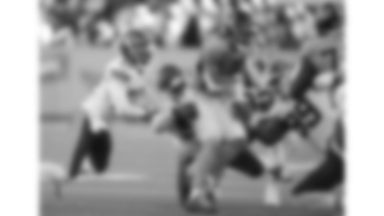 Kansas City Chiefs defensive back Chamarri Conner (27) and defensive tackle Zacch Pickens (93) make a tackle during a week 16 NFL Football game against the Tennessee Titans on Sunday, December 21, 2025 in Nashville, Tennessee.