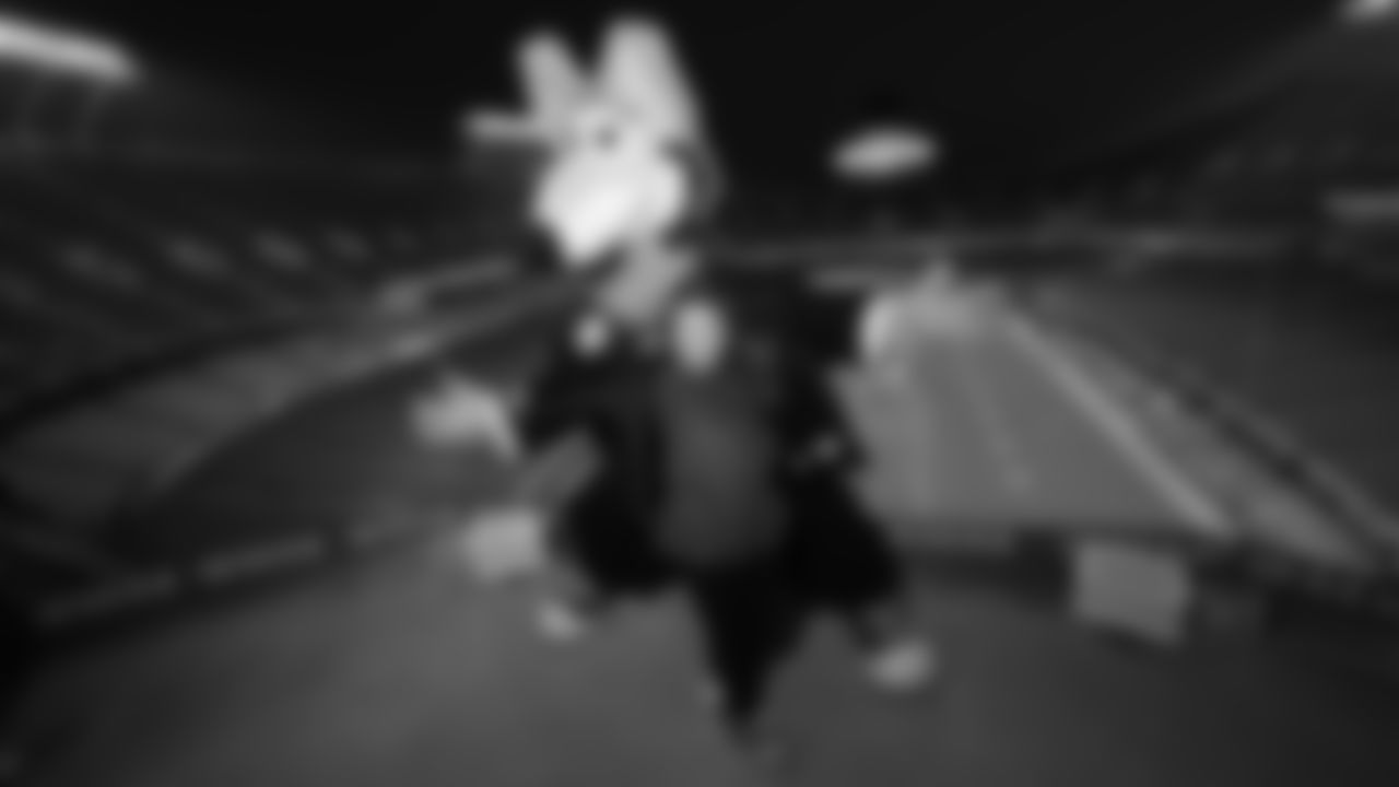 KC Wolf and fan prior to an NFL week 14 matchup against the Houston Texans, Sunday December 7, 2025.