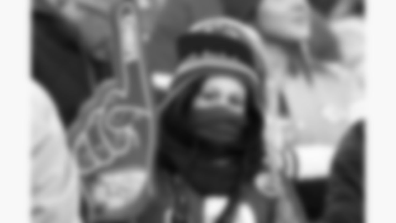 A young Kansas City Chiefs fan holds up a foam finger during a week 15 NFL football game against the Los Angeles Chargers, Sunday, December 14, 2025 in Kansas City, MO.