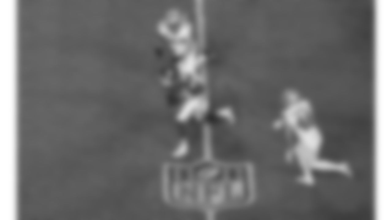 Kansas City Chiefs quarterback Patrick Mahomes (15) runs the ball over the NFL shield logo on the field during the week 6 NFL football game against the Detroit Lions, Sunday, October 12, 2025 in Kansas City, MO.