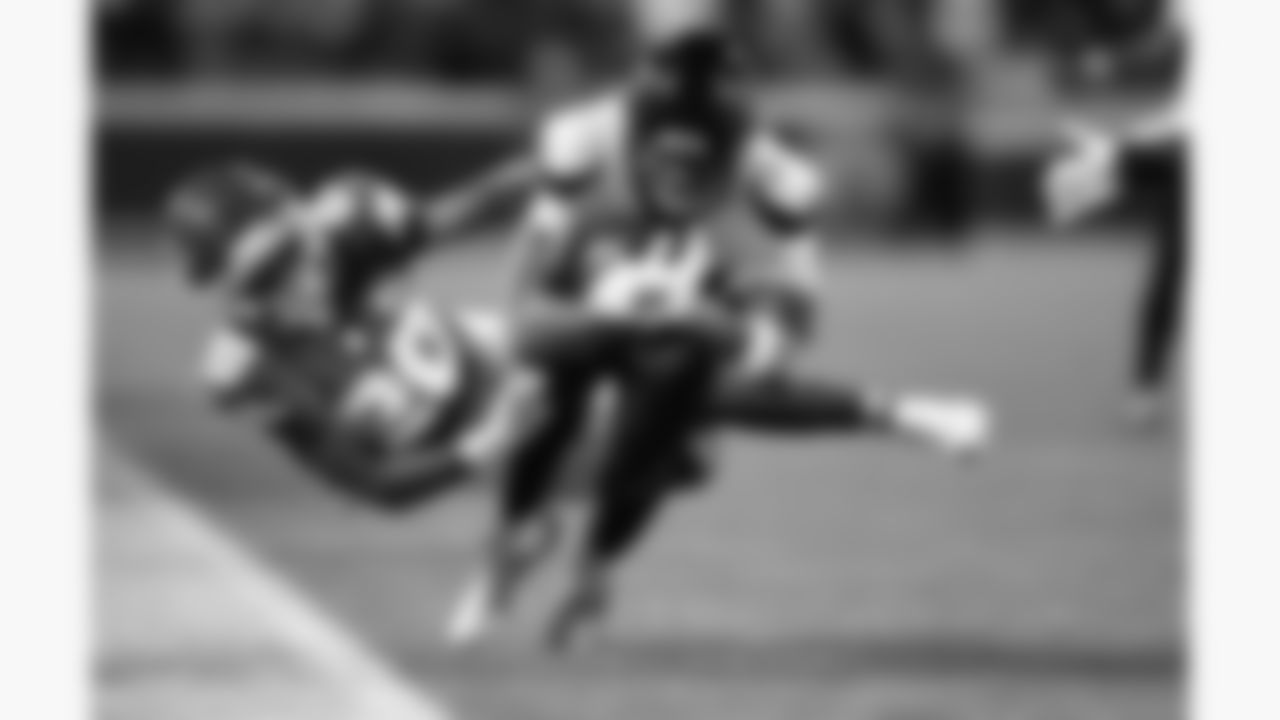 Kansas City Chiefs defensive back Nohl Williams (20) dives at Houston Texans quarterback C.J. Stroud (7) during a week 14 NFL football game, Sunday, December 7, 2025 in Kansas City, MO.