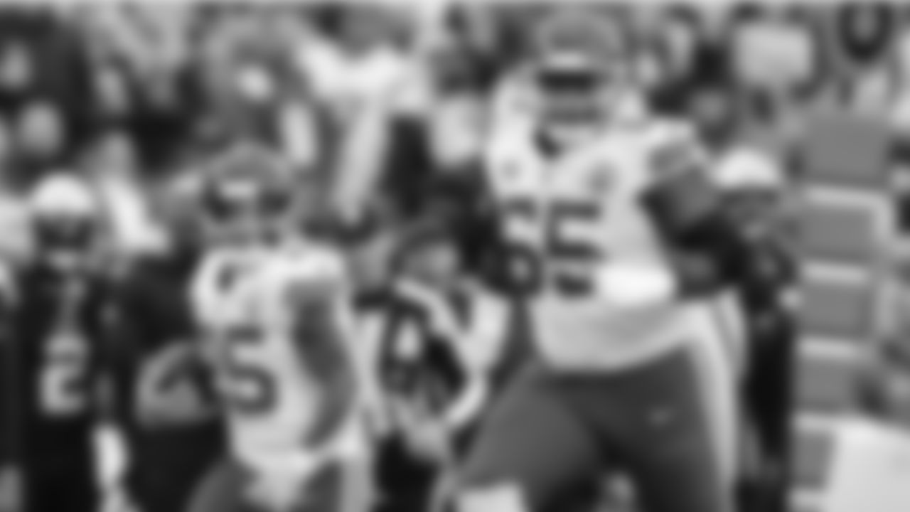 Kansas City Chiefs offensive lineman Trey Smith (65) blocks for running back Clyde Edwards-Helaire (25) during the NFL Week 15 matchup between the Kansas City Chiefs and the New England Patriots on December 17, 2023.