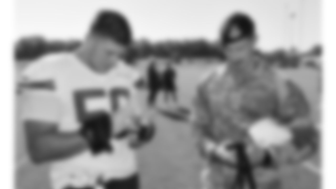 U.S. service members meet with Kansas City Chiefs defensive end George Karlaftis (56) while attending Military Appreciation Day during day 17 of Training Camp practice on Wednesday, August 13, 2025.